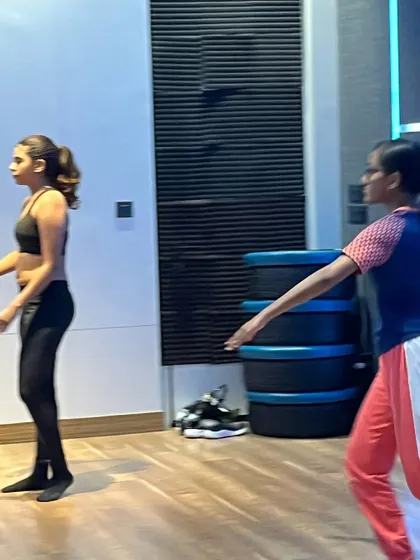 Students in a contemporary class practicing floor work and fluid movements. These exercises are fundamental to building a strong contemporary dance foundation.