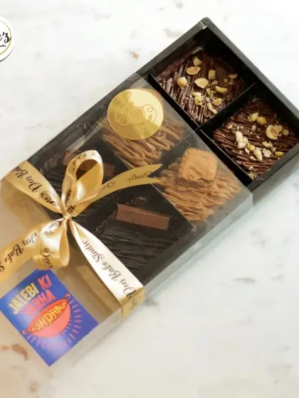 Our handcrafted gift hampers are perfect for making Rakshabandhan extra special. This box contains an assortment of our fudgy brownies, tied with a ribbon and ready for gifting.