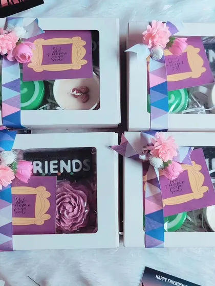 A collection of Friendship Day gift boxes, each with a "Friends" theme and other custom soaps and candles.
