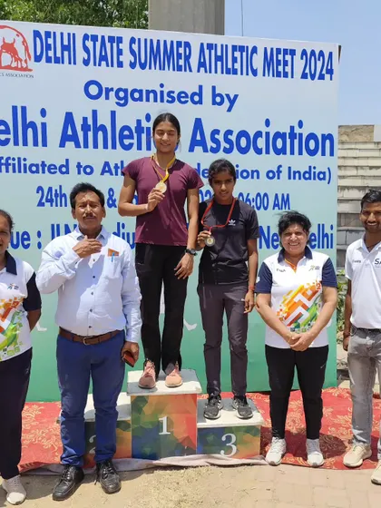 A proud moment for me, standing with my athlete on the podium at the Delhi State Summer Athletic Meet 2024. Seeing my students win is the biggest reward for a coach.