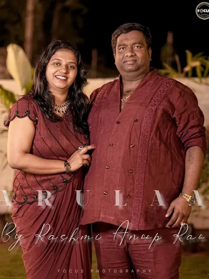 I had the pleasure of creating coordinated linen outfits for this entire family. The father wears a custom double-breasted Henley shirt, matching the color of the mother's and daughter's dhoti-style gowns.