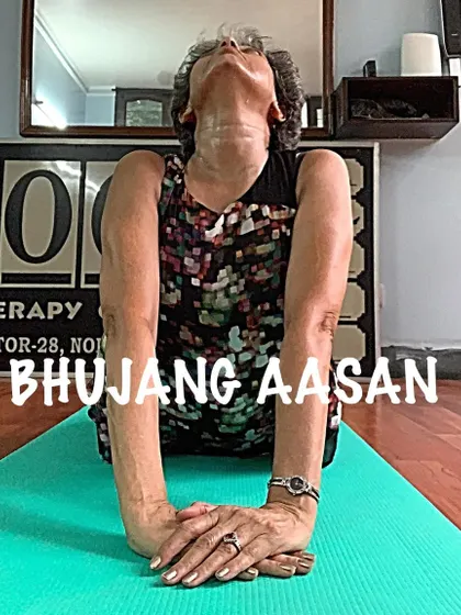 A gentle Bhujang Asan, or Cobra Pose, focusing on lifting through the chest. This strengthens the back muscles that support your growing belly.