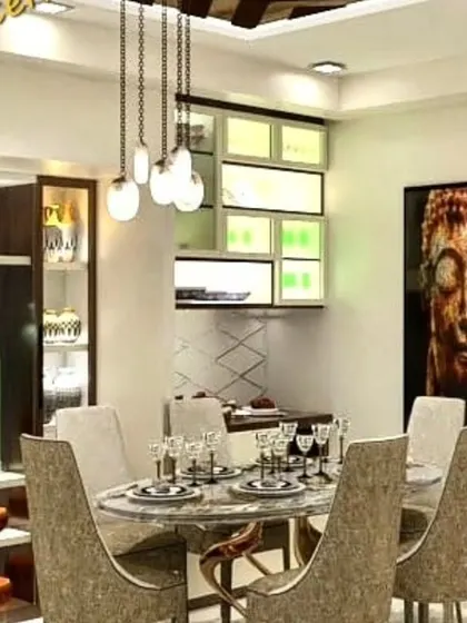 A sophisticated dining area featuring a marble-top table, upholstered chairs, and a custom-built crockery unit with glass doors and internal lighting. The design is perfect for showcasing fine dinnerware.