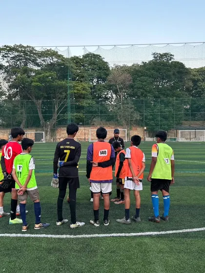 A team huddle during a training session. Communication and teamwork are skills we practice daily, not just on match day.