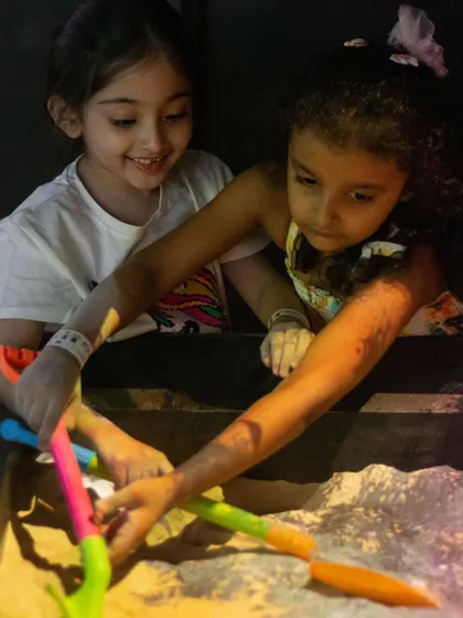 So much fun to be had digging and creating with friends in the magical illusion sand.