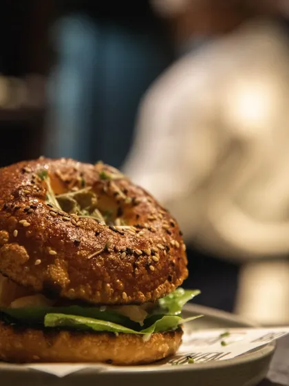 A close-up of our sourdough bagel sandwich. The tangy sourdough flavor adds an extra dimension to the classic bagel experience.