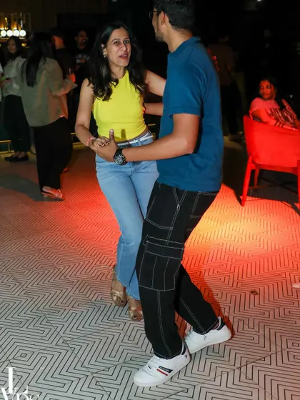 A happy couple enjoying a dance, completely in sync. The casual setting of our studio makes it easy to relax and get lost in the music.