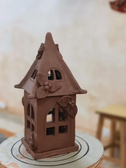 The completed clay house lantern, ready for firing. This piece showcases the potential of slab-building to create architectural and sculptural forms.