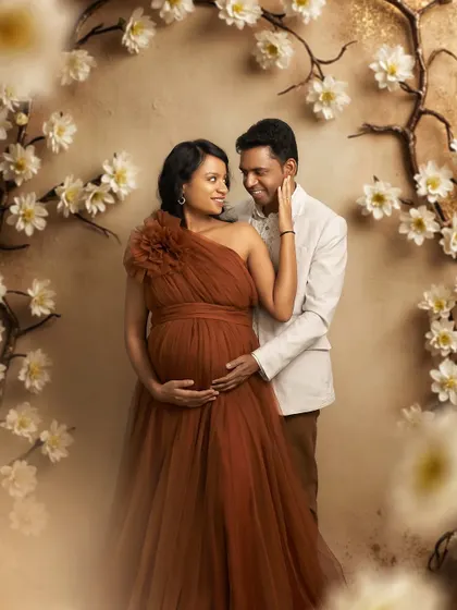 An intimate couple's portrait framed by our floral arch. The Copper gown's warm tone is perfect for romantic and timeless photos.