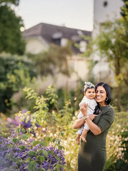 The bond between a mother and her child is so pure. This portrait, set in a lovely garden, captures that connection in a beautiful, natural environment.