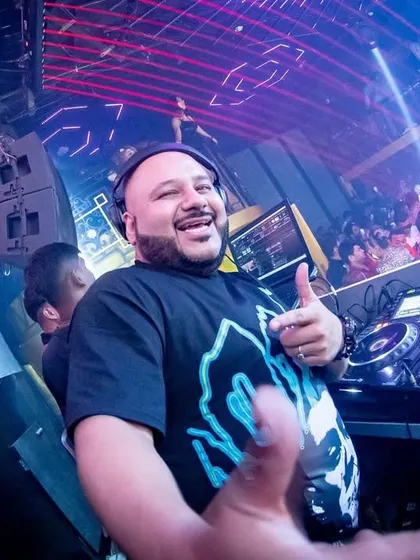 A thumbs-up from the DJ booth. This was a phenomenal night in Kolkata, and the happy faces in the crowd tell the whole story.