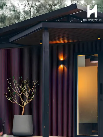 The entrance to a modern home, featuring dark fluted cladding and warm exterior lighting. This detail shot highlights the premium finishes and thoughtful design touches that define my work.