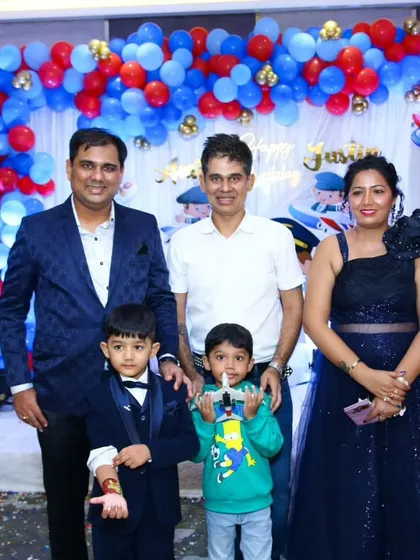 A happy family photo after a successful pilot-themed birthday party. It's a joy to celebrate with you.