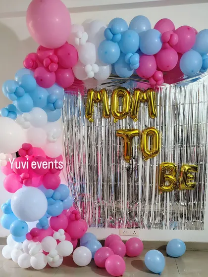 Another view of the "Mom to Be" baby shower backdrop.