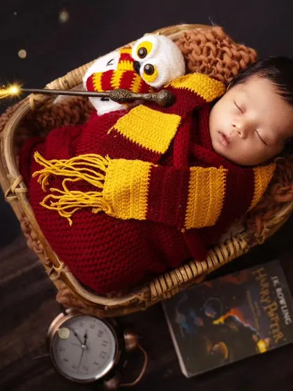 The magic is real in this Harry Potter newborn setup. I use special effects to add a little sparkle and bring the theme to life.