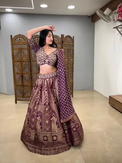 A graceful pose showing the flow and richness of the banarasi fabric.