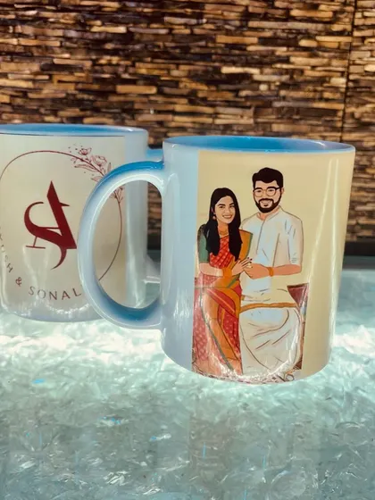 This image shows both sides of the custom illustrated mug. One side has the couple's portrait, and the other features their initials, "A" and "S," in a stylish monogram.