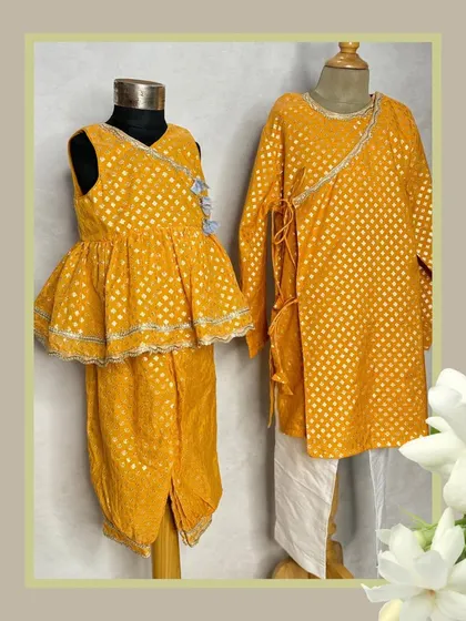 A perfect brother-sister twinning moment in our yellow brocade set. The girl's peplum top with dhoti pants complements the boy's classic angrakha-style kurta.