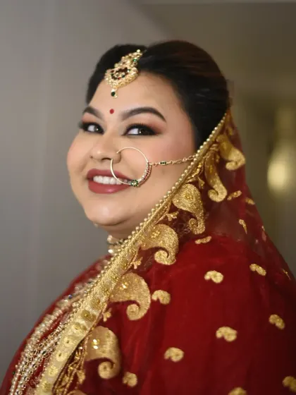 A beautiful side profile of Shreyoshi, showcasing the winged eyeliner, radiant skin, and the way the dupatta frames her face.
