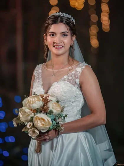 A lovely portrait of the bride at her reception. The bokeh background adds a magical touch to her elegant look.