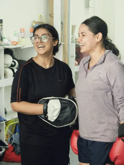 There's always time for a laugh between rounds. The friendships built here are as strong as the punches.