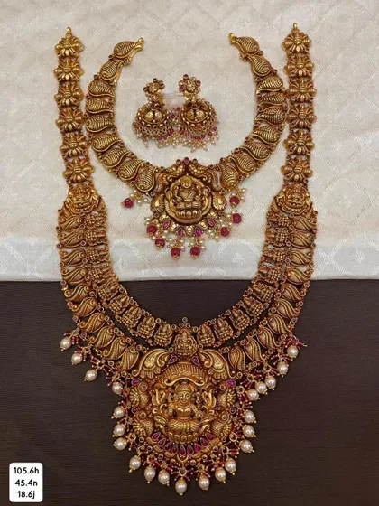 A beautiful bridal combo set in 92.5 silver with gold plating. The design is consistent across the choker, haram, and earrings, creating a perfectly coordinated look.