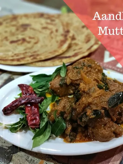Our special Andhra Mutton, a delightful treat for the winter season, served here with parathas. The curry leaves and red chillies add an authentic touch.