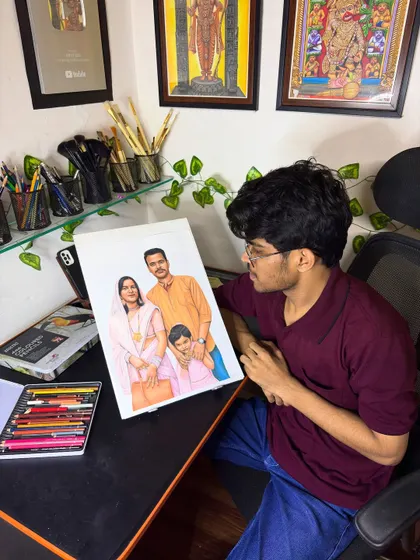 Me with the finished colour pencil sketch of a family from Prayagraj. It's always a proud moment to see the final piece come together.