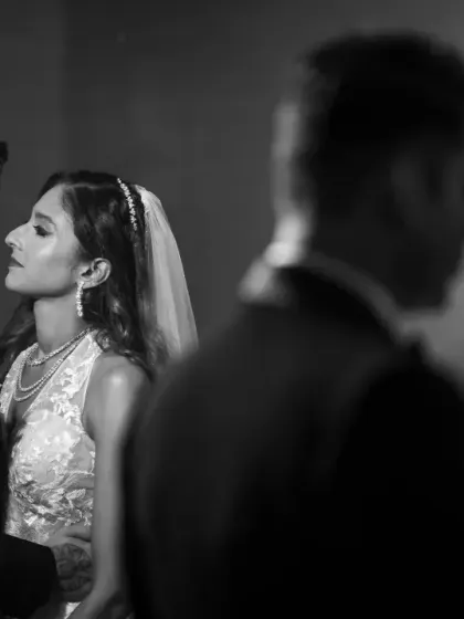Another angle from our 1940s film-inspired shoot. The use of reflections and black and white creates a layered and artistic wedding portrait.