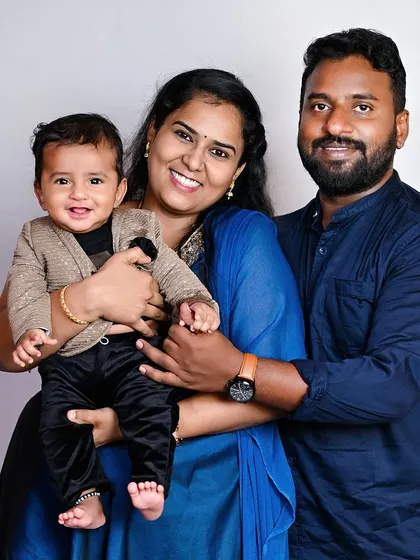 A classic family portrait with a happy, smiling baby. These are the photos that will be framed and cherished for years to come.