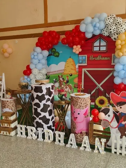 Another angle of the farmland party, showing the full setup with the birthday boy's name in light-up letters.