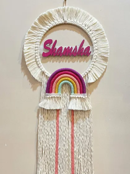 This personalized name hanging for Shamsha features a bright rainbow and colorful tassels. Customizing pieces with a child's name makes it an extra special gift they can cherish.