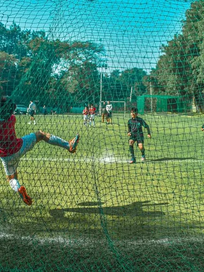 A goalkeeper makes a spectacular flying save during the finals.