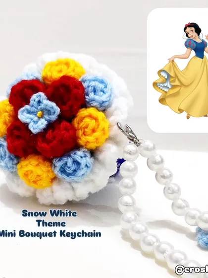 A mini bouquet keychain inspired by the colors of Princess Snow White.