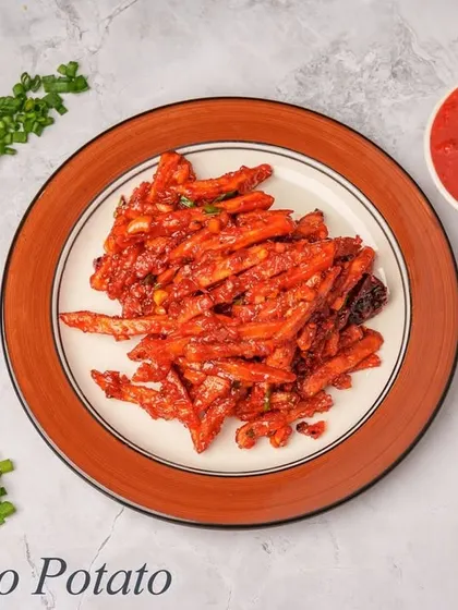 A vegetarian twist on a classic, our Kung Pao Potato features crispy potato strips tossed in a sweet, spicy, and tangy sauce with nuts and vegetables. It's a flavorful and addictive starter.