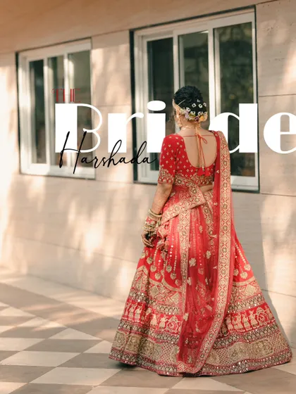 A beautiful back-shot of the bride, showcasing the intricate details of her red lehenga and hairstyle, with a modern text overlay.