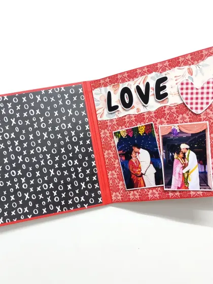 A simple and bold "LOVE" embellishment makes a statement on this page, beautifully framing two special couple photos.