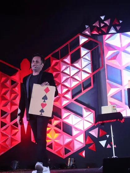 Performing a card prediction routine at a TEDx event. Even with a simple deck of cards, I can create moments of impossible coincidence that leave the audience wondering.