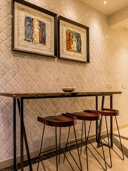 A close-up of the breakfast bar, perfect for casual meals or morning coffee, adding a rustic and earthy charm to the modern kitchen.