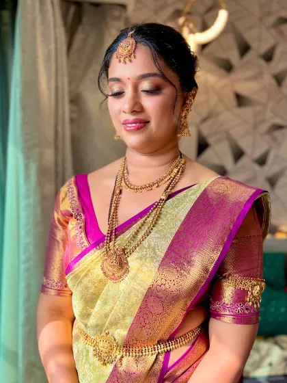 A soft and serene portrait of another South Indian bride, with glowing skin and subtle gold eyeshadow.