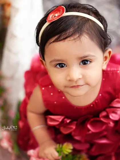 A stunning close-up portrait. Her eyes are so expressive, and the red dress makes her stand out beautifully.