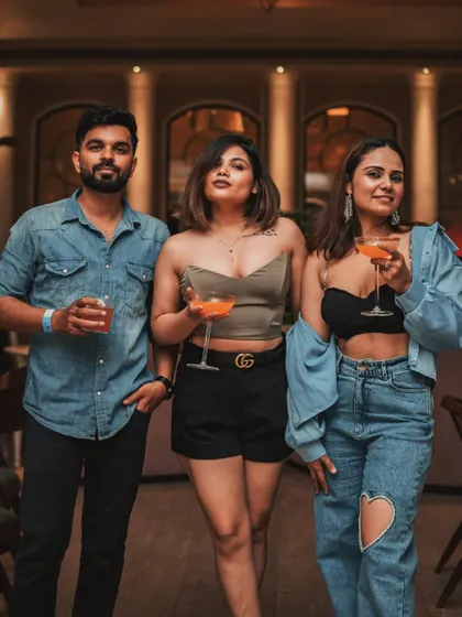A group of friends enjoying cocktails and good company. This is the essence of a night at Roxie, a place to celebrate friendships and make new memories together.