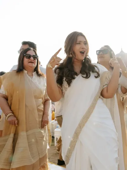 The bride's mother dancing with full energy and joy at the Haldi ceremony.