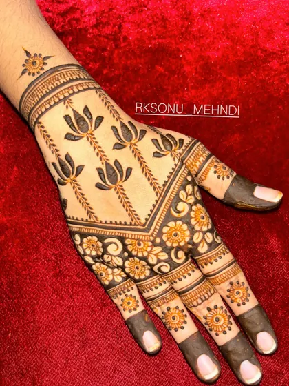 This design is a beautiful symphony of traditional Indian motifs. It features jhumka earrings, lotus flowers, and a central mandala, creating a different yet complementary look on each hand.