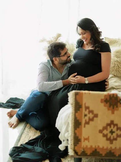 A candid moment during a cozy studio session set up to feel like home. The way he looks at her with so much love and admiration is what makes this portrait so precious.