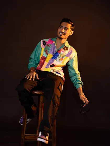 It was super fun styling YouTuber Amit Sharma, "The Indian Unboxer." We created a range of cool, casual looks, including this one with a vibrant patchwork jacket, reflecting his energetic personality.