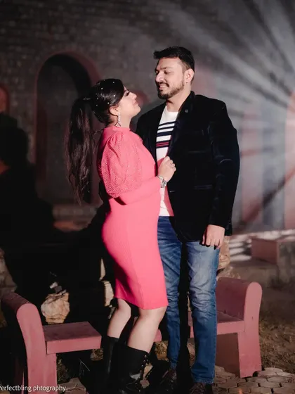 A candid and interactive shot from the same night session, capturing a look of love between the couple. This shows the blend of posed and natural moments I capture.