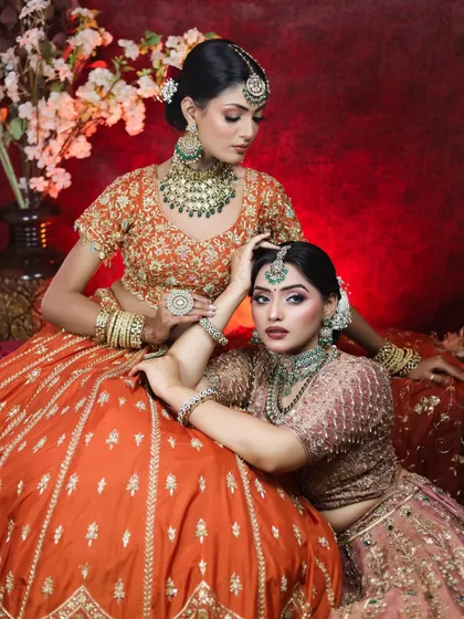 A final shot from our editorial series, capturing a moment of connection between the two models. Their flawless makeup remains perfect under professional lighting.