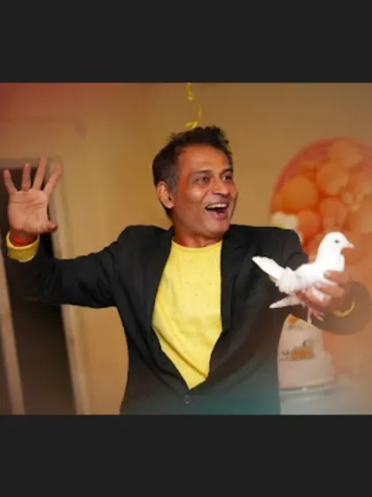 A classic moment of wonder. Performing the dove production magic trick is always a crowd-pleaser, adding a touch of elegance and surprise to birthday parties and family gatherings.