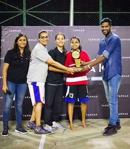 A duplicate shot of the women's team receiving their award.